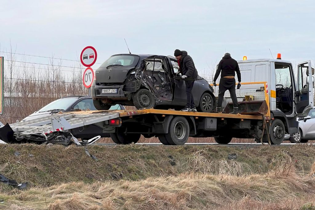 A car being loaded onto a tow truck